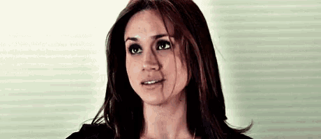 a close up of a woman 's face with her eyes closed .