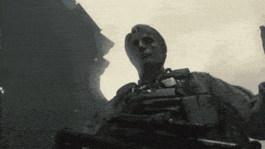 a man with a sniper rifle is standing in the dark