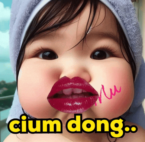 a baby with a towel wrapped around her head has red lips and the words cium dong on her face