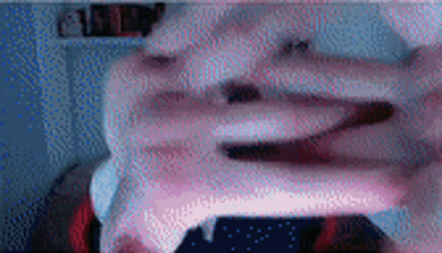 a blurry picture of a person 's face with their mouth open