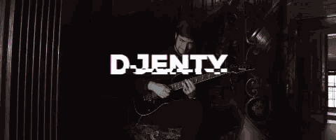 a man playing a guitar with the word djenty behind him