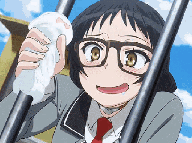 a girl with glasses and a red tie wipes her face with a napkin