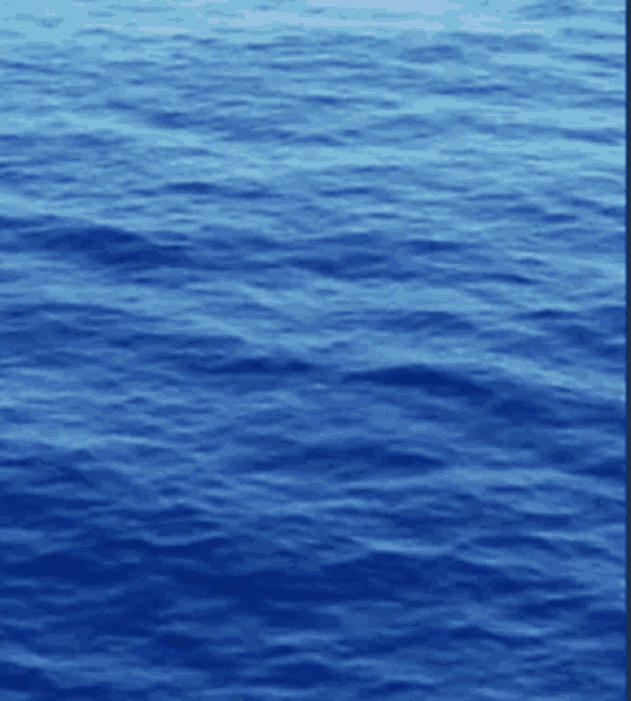 a close up of a body of water with waves
