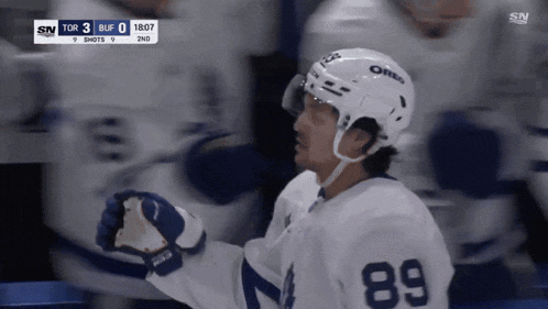 a hockey player wearing the number 89 jersey