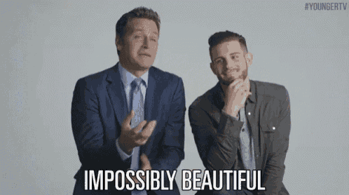 two men in suits and ties are standing next to each other and one of them says impossiblely beautiful