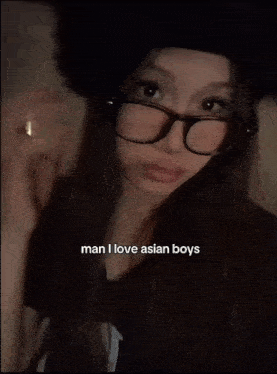 a woman wearing glasses is talking about asian boys