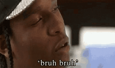 a close up of a man 's face with the words `` bruh bruh '' written on the bottom .