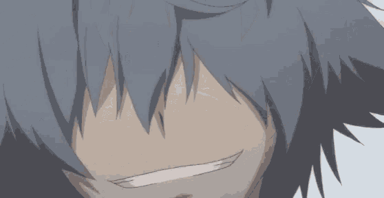 a close up of a person 's face with a white smile