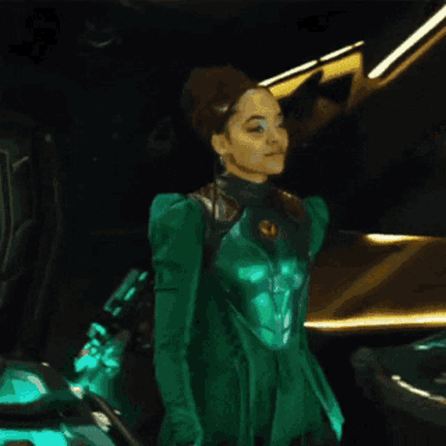 a woman in a green suit is standing next to a car