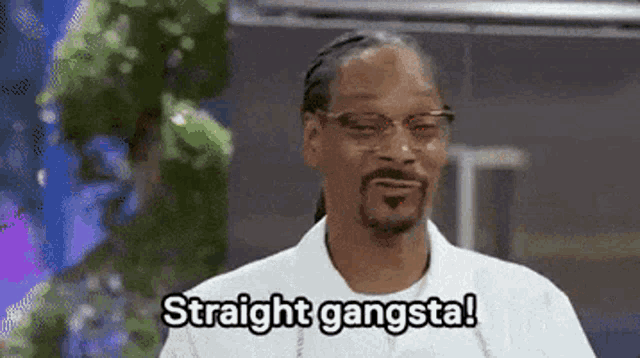 snoop dogg is wearing glasses and a white shirt and says straight gangsta .