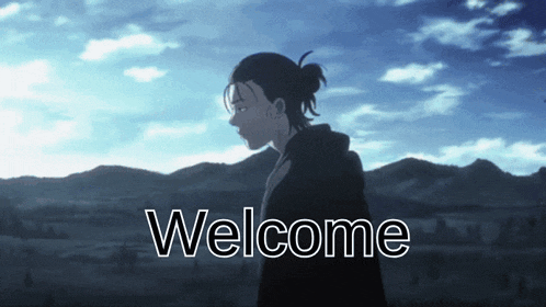 a man in a ponytail is standing in front of mountains with the words welcome below him
