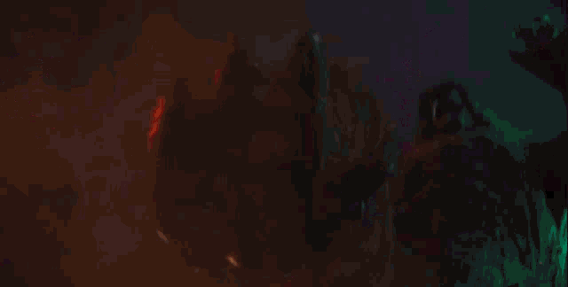 a monster is attacking a city at night with a purple light in the background