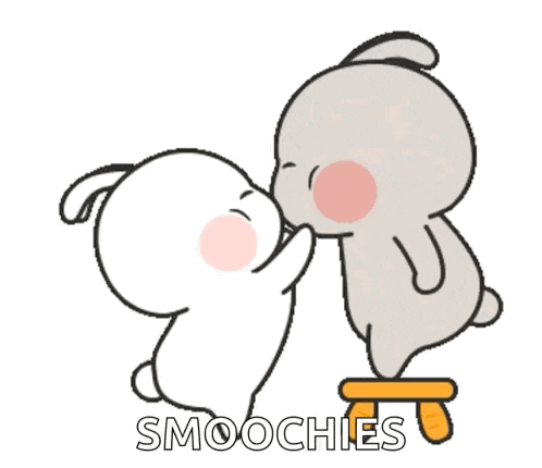 a couple of rabbits kissing each other with a heart above them .