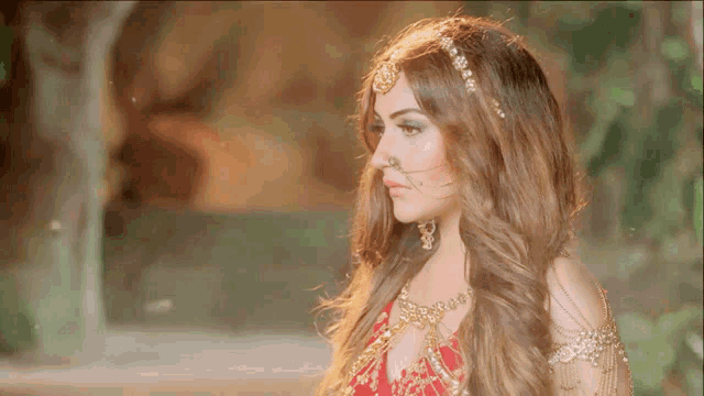a woman with long hair wearing a nose ring