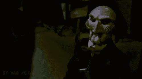 a puppet is wearing a mask with a spiral on it 's face