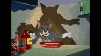 a cartoon of tom and jerry sitting at a table with a bowl of food and ketchup
