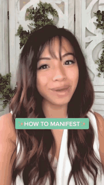 a woman 's face is shown with the words " how to manifest " above her