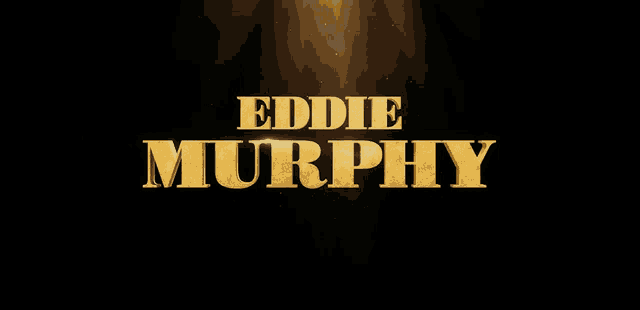 the name eddie murphy is displayed in gold on a black background