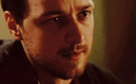 a close up of a man 's face with a beard and mustache .