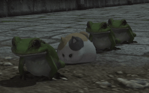 three frogs are sitting next to each other on a brick floor