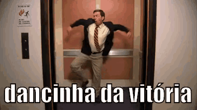 a man in a suit and tie is dancing in an elevator with the words dancinha da vitoria above him