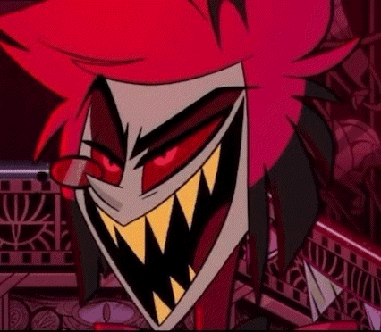 a close up of a cartoon character with red hair and sharp teeth smiling .