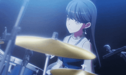 a girl playing drums with a microphone in the background