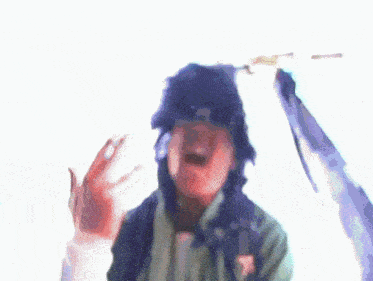 a blurry image of a person wearing sunglasses