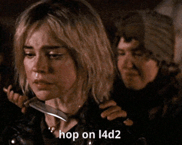 a woman is holding a knife to her neck and the words hop on l4d2 are above her
