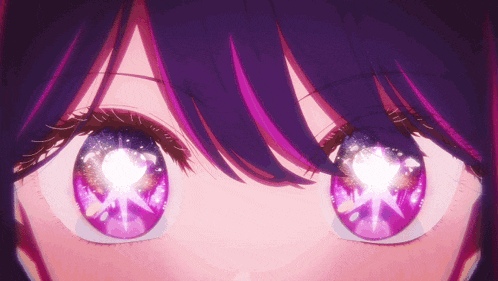 a close up of a person 's eyes with purple and pink highlights