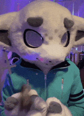 a person in a white furry costume with a blue jacket