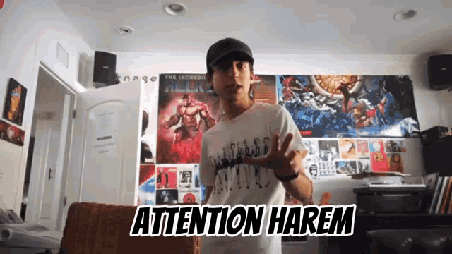 a man wearing a white shirt that says attention harem is standing in front of a wall full of posters