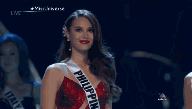 two miss universe contestants are standing next to each other and smiling
