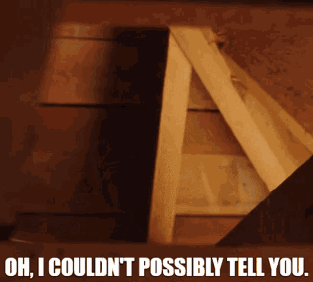 a wooden box with the words oh i couldn t possibly tell you