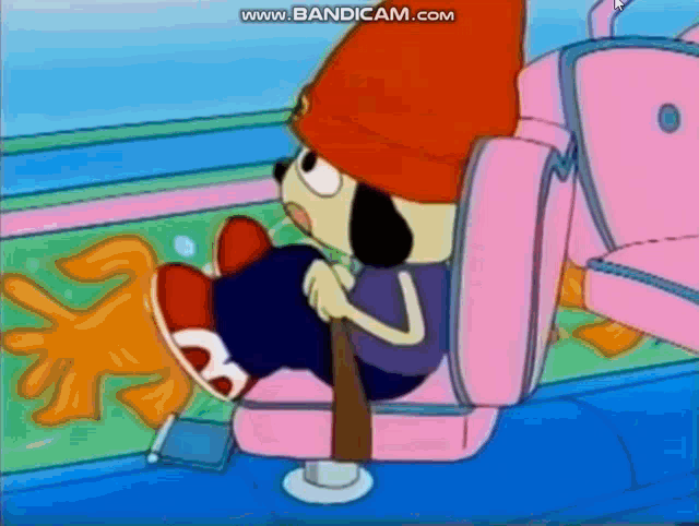 a cartoon character is sitting in a pink car seat with a seat belt .