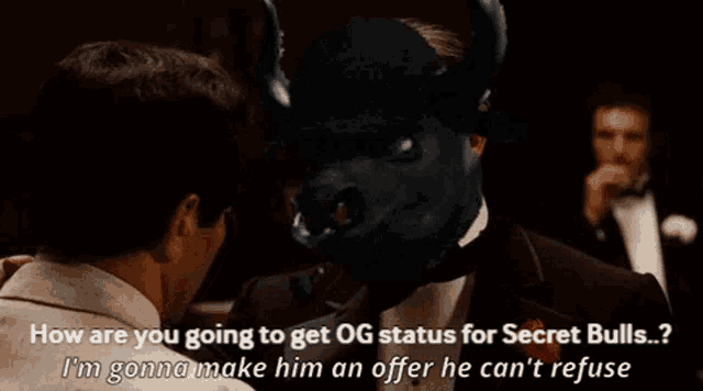 a man in a tuxedo is talking to another man with a black bull on his head