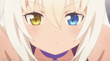 a close up of a girl 's face with two different colored eyes .