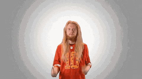 a man with long hair and a beard is wearing an orange jersey with the number 10 on it