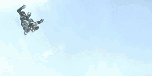 a blurred image of a person in a superhero costume jumping in the air