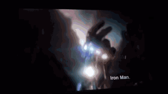 a close up of a man 's face with a light shining on it