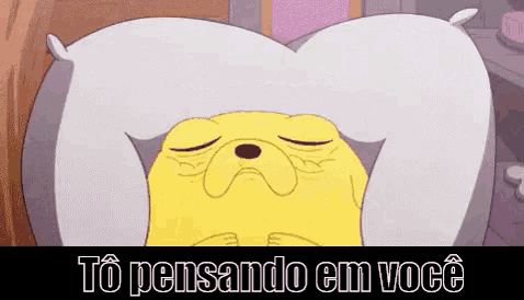a cartoon dog is laying on a pillow with the words to pensando em você below him