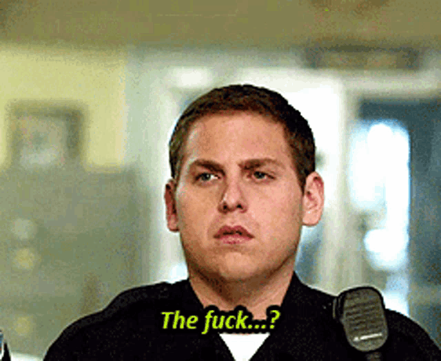 a man in a police uniform is asking the question the fuck