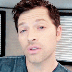 a close up of a man 's face with his eyes closed