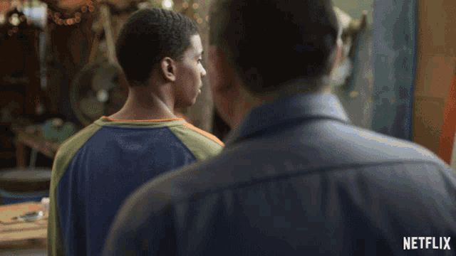 a man talking to another man with a netflix logo on the bottom