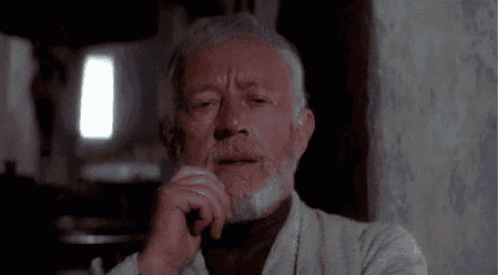 an older man with a beard is sitting down with his hand on his chin and his eyes closed .