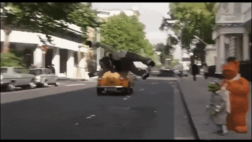 a man is flying through the air while driving a car