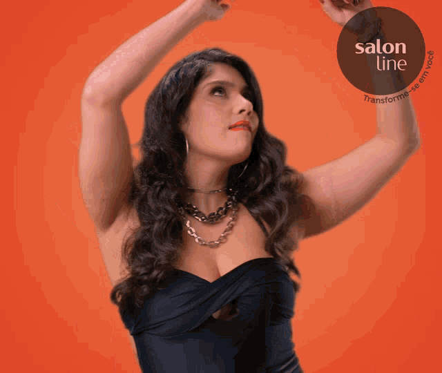 a woman in a black dress is standing in front of an orange background with a salon line logo