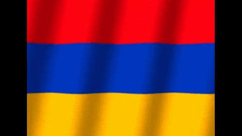 the flag of armenia is red , blue and yellow and is waving in the wind .
