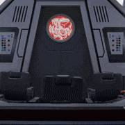 a futuristic room with a red dragon on the door