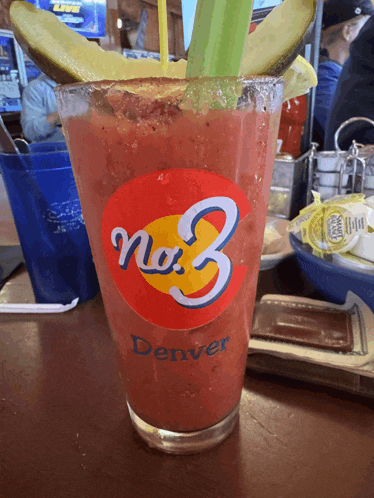 a bloody mary from no. 3 denver sits on a wooden table